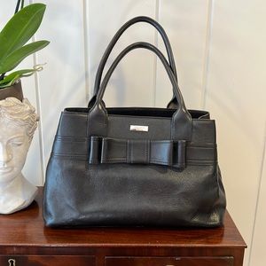 Kate spade black handbag with bow And polkadot lining.